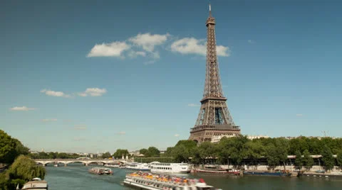 Timelapse of the Eiffel tower and the great river 'La Seine' with boats Stock Footage 26746840