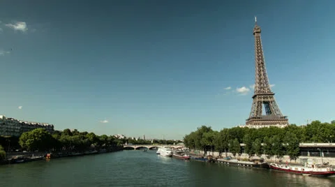 Timelapse of the Eiffel tower and the Seine. Boats passing by Stock Footage 26745043