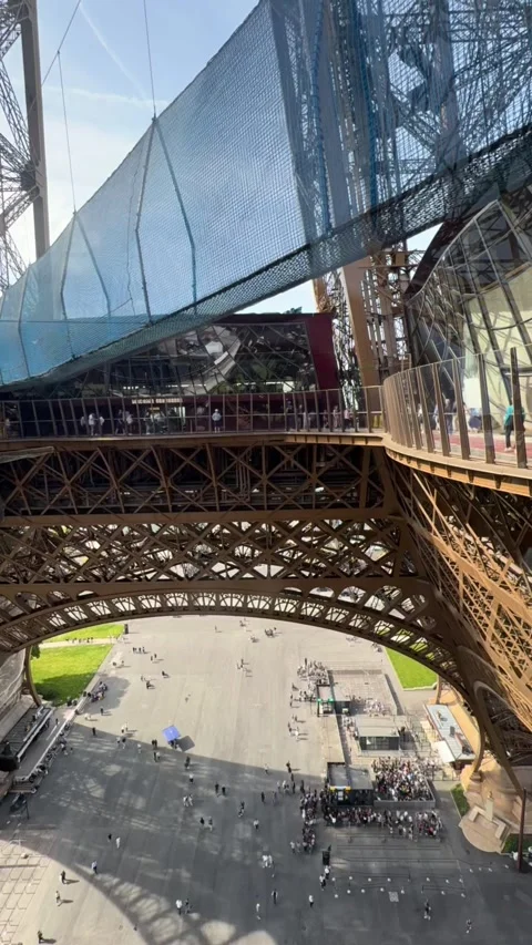 TIMELAPSE | Eiffel Tower structure with crowds viewing Paris below Stock Footage 334107254