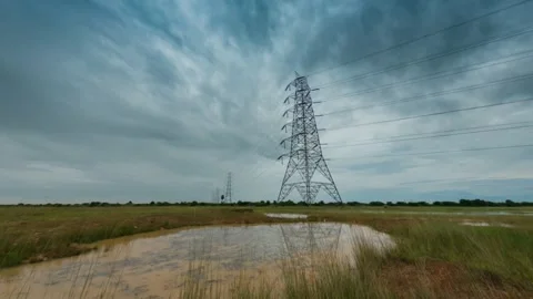 Timelapse of Electricity tower with a Moving Cloud Stock Footage 168609727