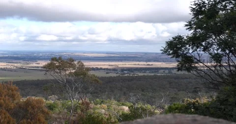 Timelapse of an elevated view of a vast expanse of Australian fields Vídeos de archivo 277267575