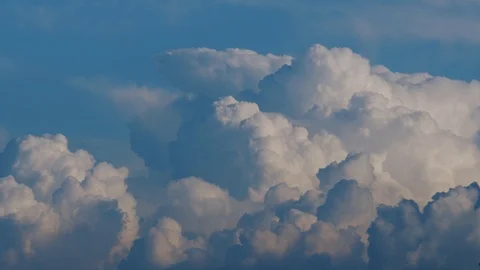 Timelapse: epic gloomy storm clouds moving fast over blue sky background Stock Footage 120505176
