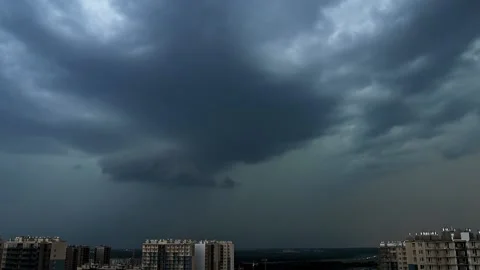 Timelapse of epic storm clouds over the city. Sky with lightning strikes Stock Footage 133831828