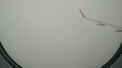 Timelapse, epic view from airplane window of huge pile of stunning giant clouds Video stock 245703070