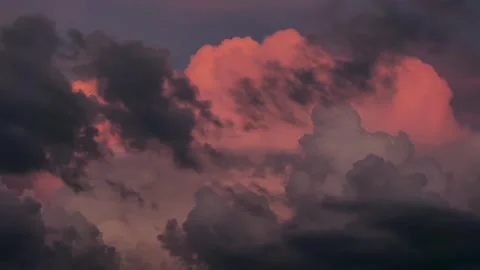 Timelapse evening clouds fast moving away, rolling dark sunset clouds. Amazing Stock Footage 258263274