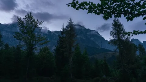 Timelapse of evening clouds moving over Austrian Alps mountain landscape Stock Footage 320125239