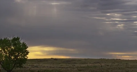 Timelapse - Evening clouds over prairie hill Stock Footage 83598250