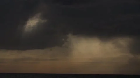 Timelapse, evening clouds through which the rays of the bright sun play Stock Footage 277443517