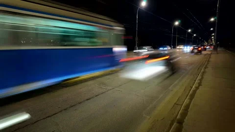 Timelapse of evening traffic on old road, with cars appearing blurred Stock Footage 300882741