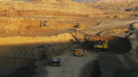 Timelapse. Excavator loading huge dump trucks Stock Footage 10756339