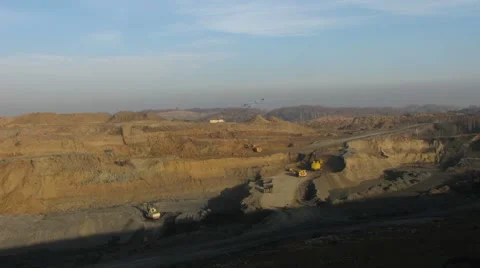 Timelapse. Excavator loading trucks, huge dump  Video stock 49342978