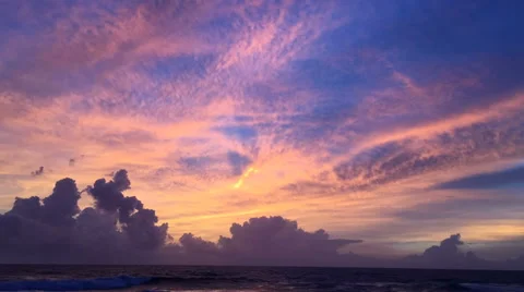 Timelapse of an extremely colorful sunset overlooking the ocean Video stock 61830313