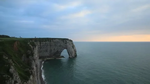 Timelapse of the famous limestone cliffs near Etretat at sunset, France Stock Footage 294122907