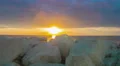 Timelapse of fantastic sunrise over sea. White stones on coast. Luxury resort 4k or 4k+ Resolution
