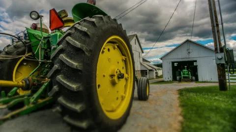 Timelapse of a farm tractor on corn farm Stock Footage 27667428