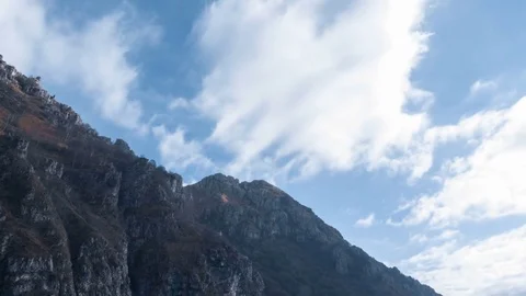 Timelapse of Fast Clouds and Slope of a Mountain Stock Footage 83932457