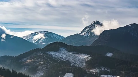Timelapse fast Clouds motion in winter alpine mountains nature sunny landscape Stock-Footage 167938388