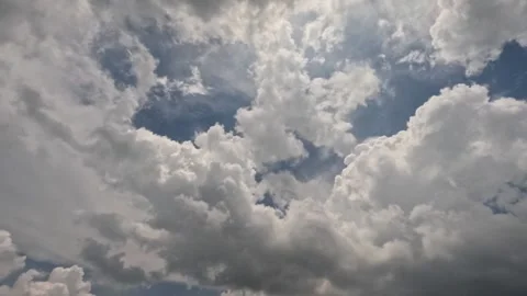 Timelapse Fast moving black and white clouds during the day Stock Footage 307432947