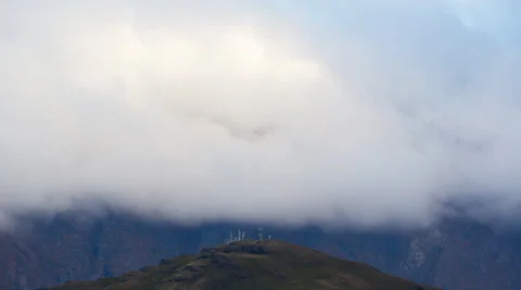 Timelapse of fast moving clouds and fog over distant hills Stock Footage 34353329