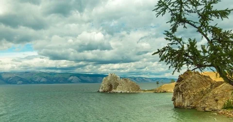 Timelapse. Fast moving clouds over the lake Baikal. View of the Baikal Bay Stock Footage 78596503