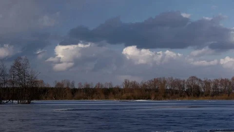 Timelapse fast moving clouds over blue weather change winter water scenery Video stock 95121611