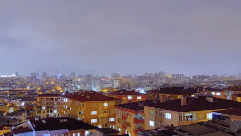 Timelapse: fast moving clouds over living apartment building in Turkey at night Stock Footage 335054166