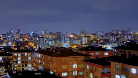 Timelapse: fast moving clouds over living apartment building in Turkey at night Stock Footage 340450373