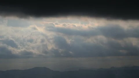 Timelapse of fast moving dark clouds and dramatic rays Stock Footage 290279435
