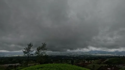 Timelapse of fast moving dark clouds covering the sky Stock Footage 307416772
