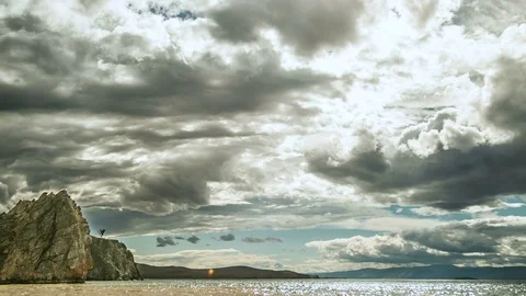 Timelapse. Fast moving dramatic clouds over the lake Baikal. Video stock 81208177
