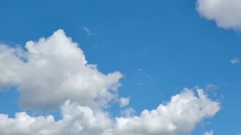 Timelapse of fast moving low cumulus and stratus clouds on a sunny day Stock Footage 136530910