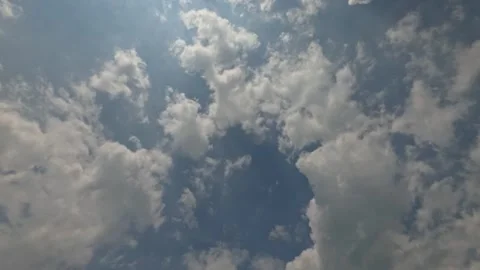 Timelapse of fast moving white clouds with dramatic light Stock Footage 321862170