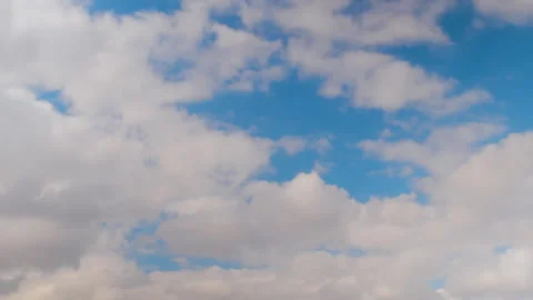 Timelapse - fast moving white clouds in the blue sky - cloudscape Stock Footage 335050902