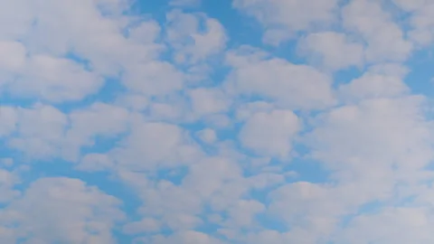 Timelapse - fast moving white clouds in the blue sky - cloudscape Stock Footage 335050988