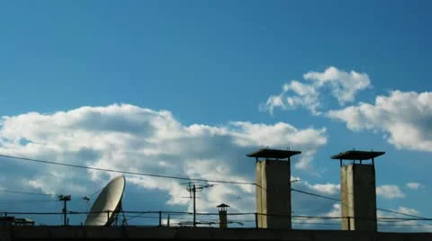 Timelapse of fast stormy clouds and building roof with chimneys Vidéo 11102485