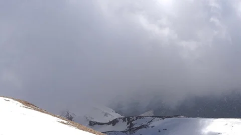 Timelapse of fastly moving clouds above the mountain Stock Footage 74106161