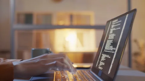 Timelapse of Female Programmer Writing Code on Laptop at Night Stock Footage 123276480