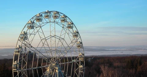 Timelapse of Ferris wheel close-up view from fir-trees. Stock Footage 109550428
