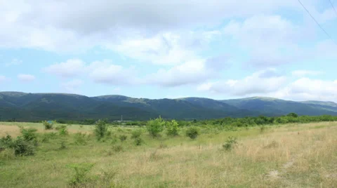 Timelapse field with hills Видео 38524316