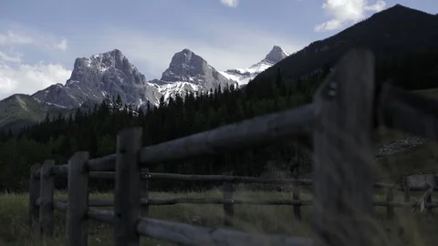 Timelapse of a field overlooking the Three Sisters in Alberta Stock Footage 90835869