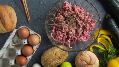 Timelapse flatlay of chef sprinkling spices on minced meat with ingredients.. Stock Footage 321314203
