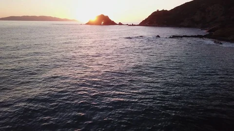 Timelapse fligt over the sea at sunset with islands at distance Stock Footage 106542156