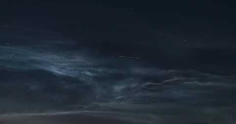 Timelapse of floating silvery clouds in the night sky Stock Footage 120537910