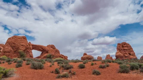 Timelapse of flow of clouds in arches national park, utah, usa, 4k Stock Footage 105589413