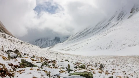 Timelapse is flowing in the snowy high mountains at dawn Stock Footage 89206255
