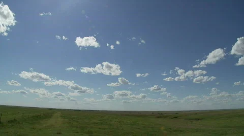 Timelapse of fluffy clouds against brilliant blue sky Stock Footage 361952