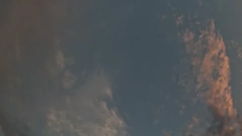 Timelapse fluffy Cumulus clouds moving in bright sunset sky. Abstract aerial Stock Footage 252730146