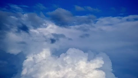 Timelapse of fluffy white clouds in a blue sky Stock Footage 317604009
