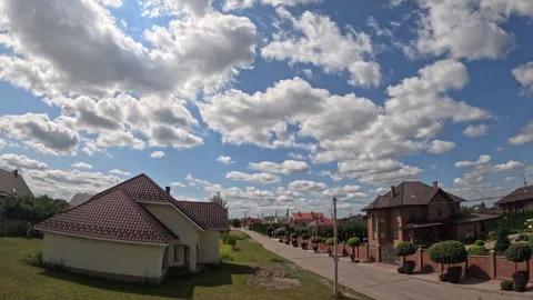 Timelapse of fluffy white clouds. Video of clouds flying across the blue sky Stock Footage 284206864