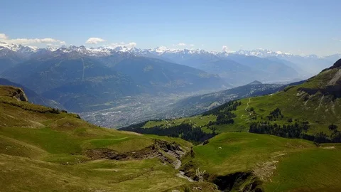 Timelapse Fly into valley from top of mountain above treeline Stock Footage 128714083